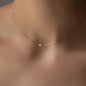 Necklace SEA MINI in Rose gold with little white pearl worn on woman