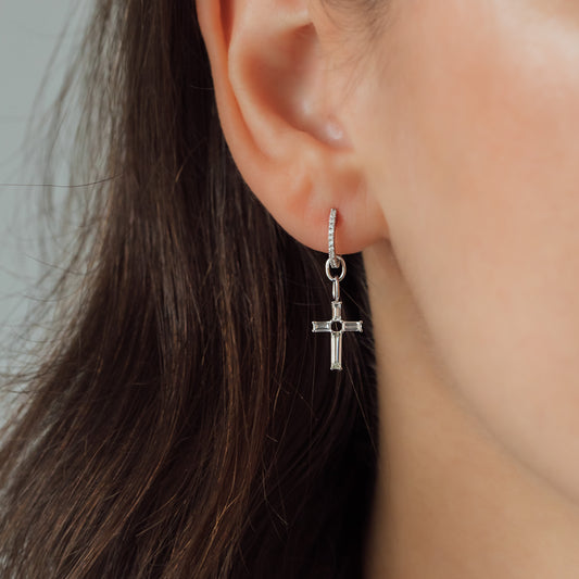 ear with earring and cross pendant