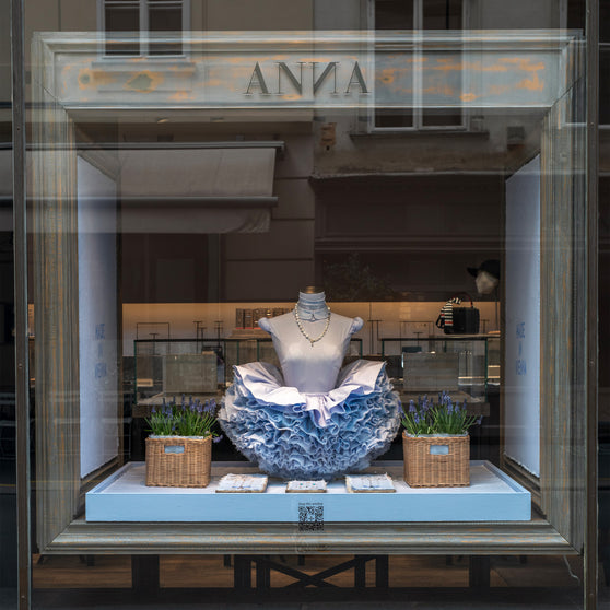 ANNA Store window with ANNA Doll 16 in light blue