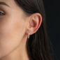 Woman wearing hoop earring Chloe in 15mm with white diamonds