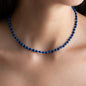 short necklace Elliot with lapis lazuli gemstone pearls and 18 KT rose gold closure worn on woman