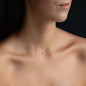 woman wearing filigree ANNA necklace with diamond pendant in 18 kt rose gold