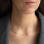 woman wearing filigree 18 kt rose gold necklace around neck