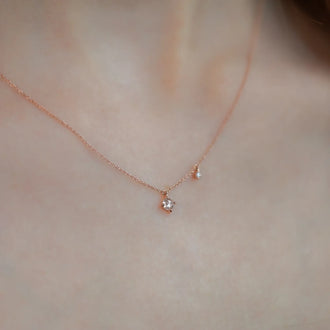 necklace Leona petite in rose gold with two diamonds worn 