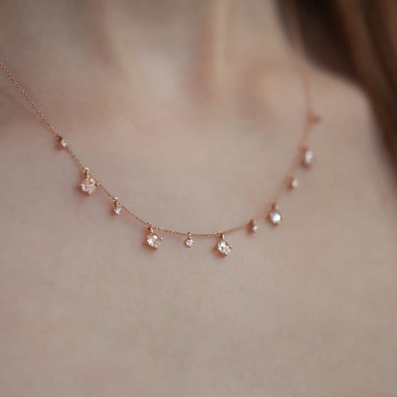 Close up of ANNA necklace leona in 18 kt solid rose gold with diamonds worn