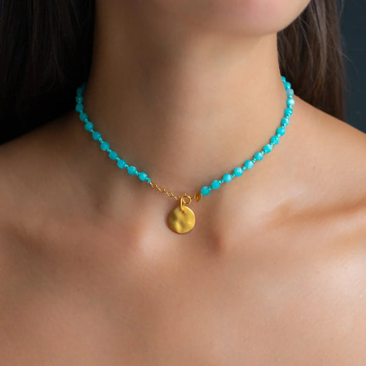 cleavage of woman wearing amazonite necklace with 18 KT yelow gold pendant