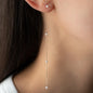 close up of Pendant Aria in 18 KT Rose gold with white pearls worn on ear stud sea mini on woman