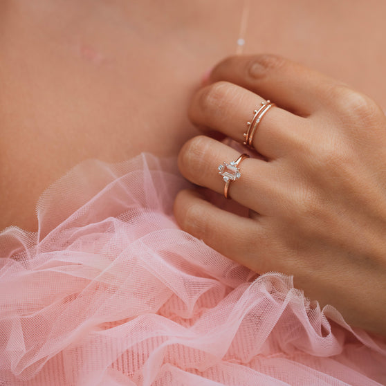 Ring JOELLE in rose gold, with white diamonds and morganite gemstone worn on womans finger