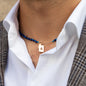 close up of necklace elliot with lapis lazuli and 18 kt rose gold pendant worn on men