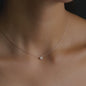 woman wearing 18 kt rose gold necklace with diamond pendant from anna