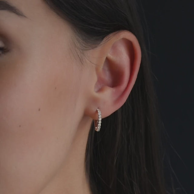 woman wearing 15mm diamond hoop earring in 18 kt rose gold 