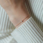 bracelet SOUL in rose gold with white diamond on womans wrist
