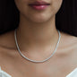 front view of woman wearing diamond collier