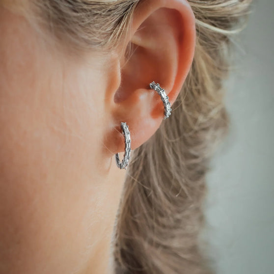 Woman wearing Ear Cuff and Earring JOLIE with white diamonds and in white gold