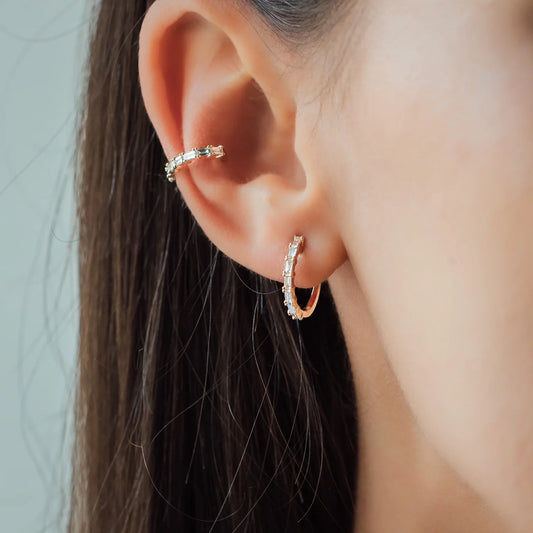 Woman wearing Ear Cuff and Earring JOLIE with white diamonds and in yellow gold