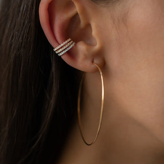 Womans ear with rose gold earring and ear cuff Claire in rose gold, white gold and yellow gold