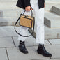 woman wearing a white jeans and black boots and blazer with the ELLEN handbag in beige
