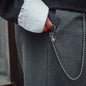 Detail picture of Outfit with grey pants, white shirt and steel keychain