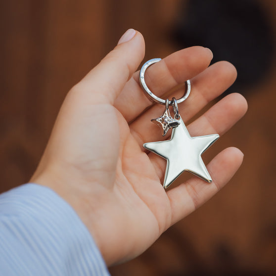hand holding star keychain with little ANNA signature star pendant