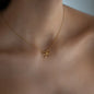 close up of necklace Daisy in yellow gold worn on womans neck