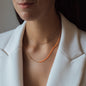 Necklace Nala in rose gold with orange details worn from woman