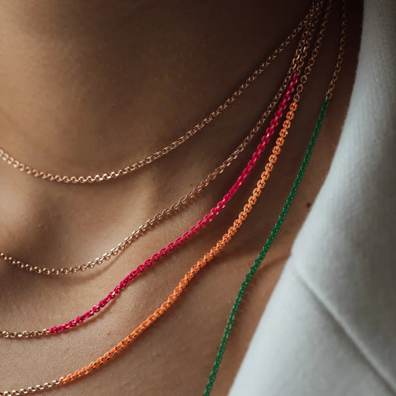 close up of necklaces NALA with pink, orange and green details