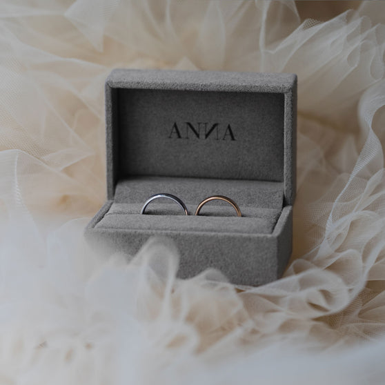 wedding rings in rose gold and white gold in grey jewelry box from anna on tulle