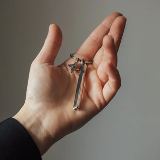 Hand holding keychain BAR with ANNA signature star